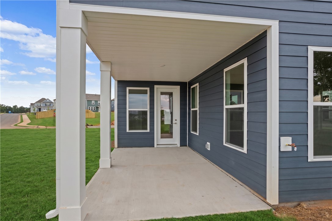631 Sweetspire Trail, Unit 148 Seneca, SC 29678 - Photo 31 of 36 An inviting covered patio extends outdoor living space, perfect for relaxing.