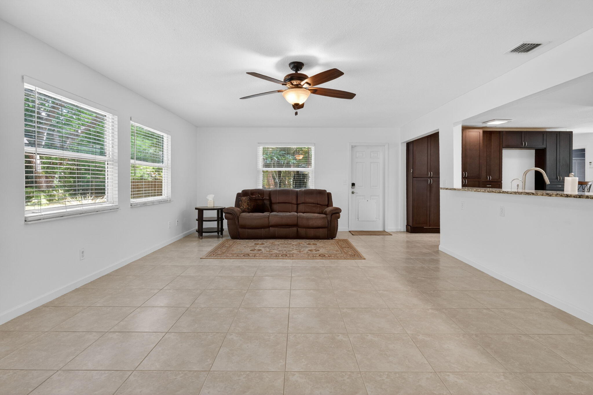 17391 Alexander Run Jupiter, FL 33478 - Photo 25 of 55 a living room with furniture and a window
