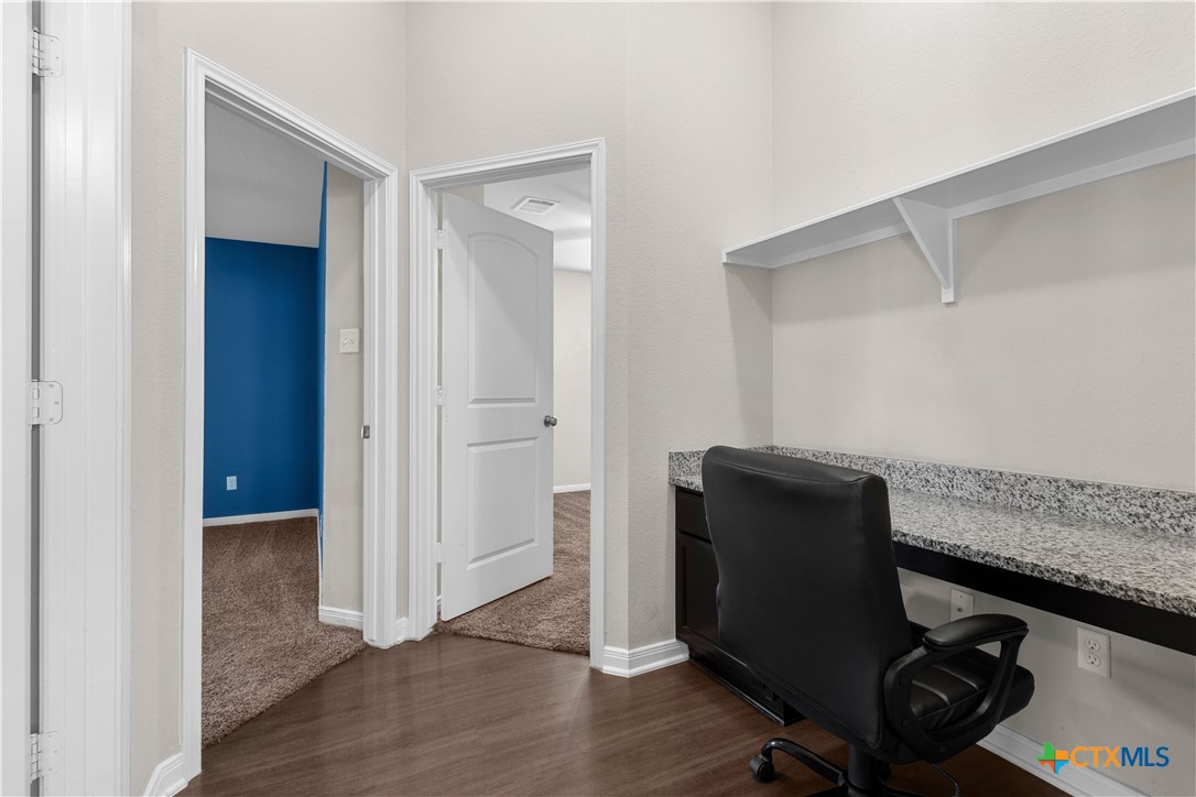3615 Addison Street Killeen, TX 76542 - Photo 20 of 47 a view of workspace with wooden floor and bedroom
