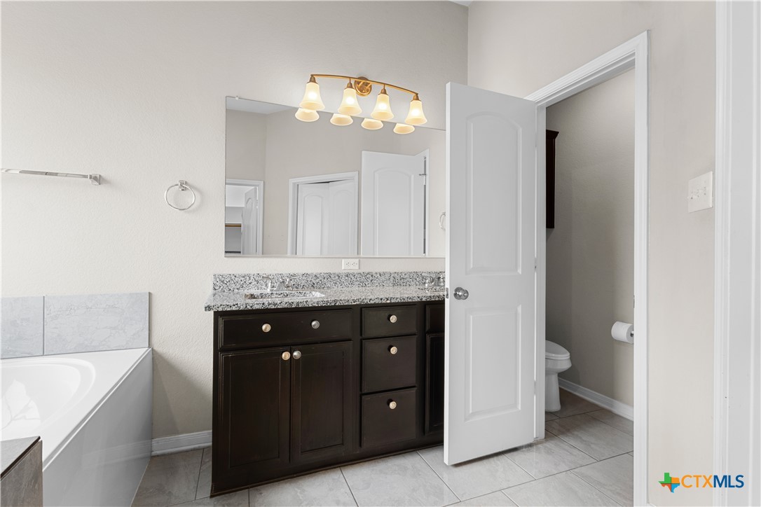 3615 Addison Street Killeen, TX 76542 - Photo 28 of 47 a bathroom with a sink a vanity and a mirror