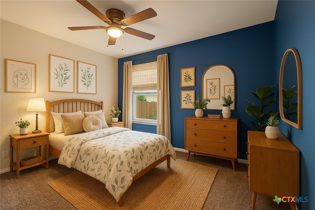 3615 Addison Street Killeen, TX 76542 - Photo 31 of 47 a bedroom with a large bed and a chandelier fan