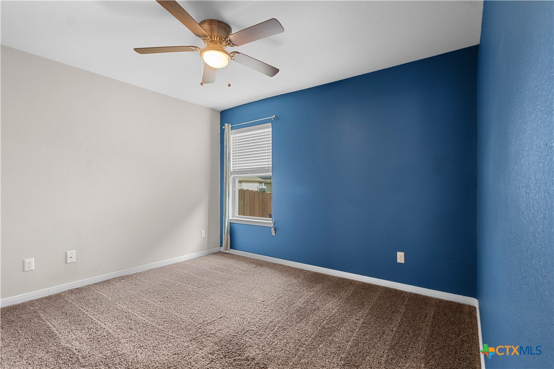 3615 Addison Street Killeen, TX 76542 - Photo 34 of 47 an empty room with a window and a fan