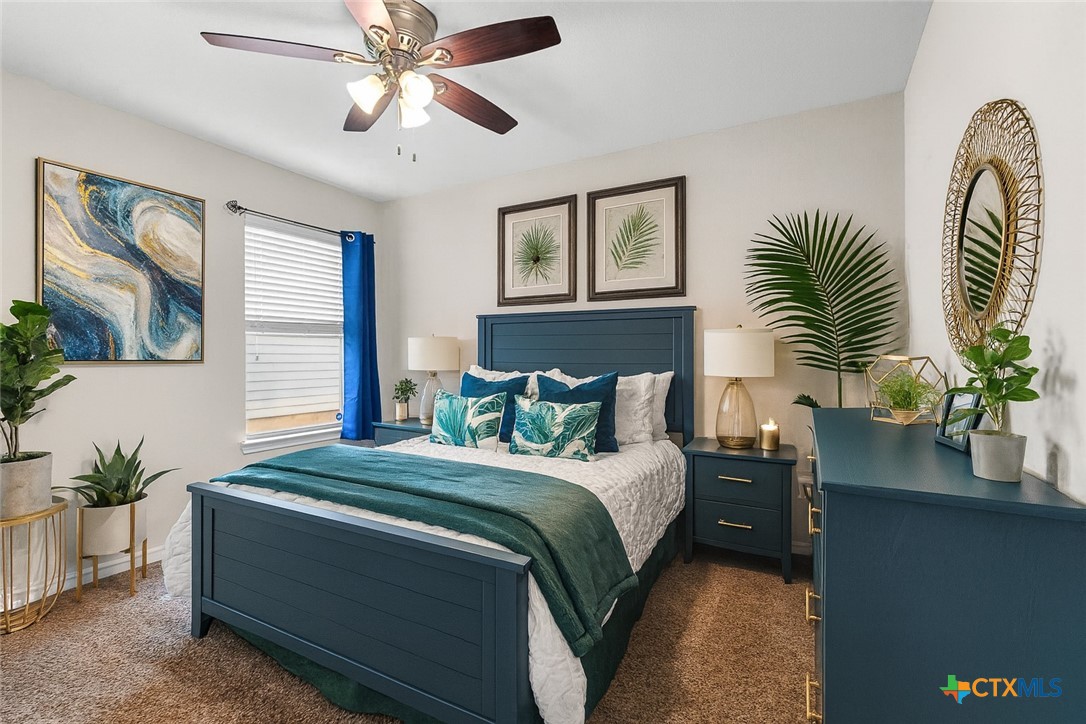 3615 Addison Street Killeen, TX 76542 - Photo 38 of 47 a bedroom with bed and a potted plant