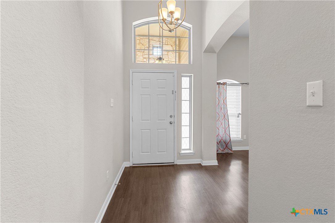 3615 Addison Street Killeen, TX 76542 - Photo 6 of 47 an empty room with wooden floor and windows