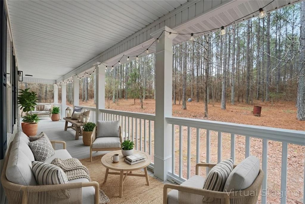 1227 Al Roberts Road Senoia, GA 30276 - Photo 11 of 43 a living room with furniture and a large window