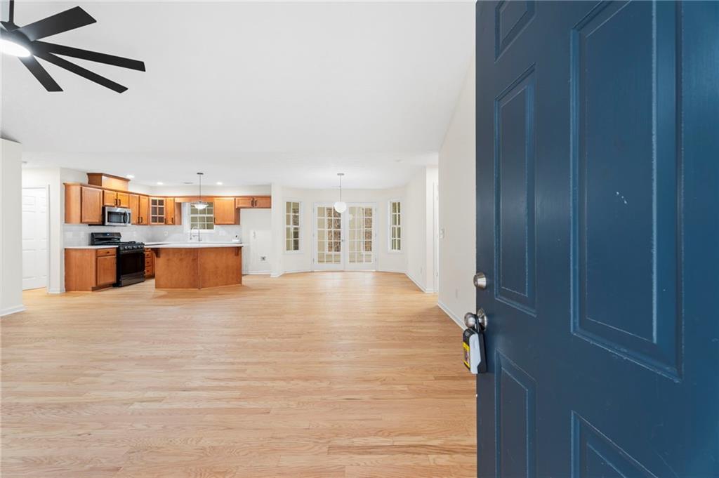 1227 Al Roberts Road Senoia, GA 30276 - Photo 17 of 43 a view of a kitchen with a refrigerator and a window