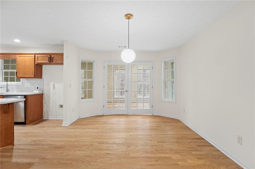 1227 Al Roberts Road Senoia, GA 30276 - Photo 23 of 43 a view of a kitchen with granite countertop a sink cabinets and wooden floor