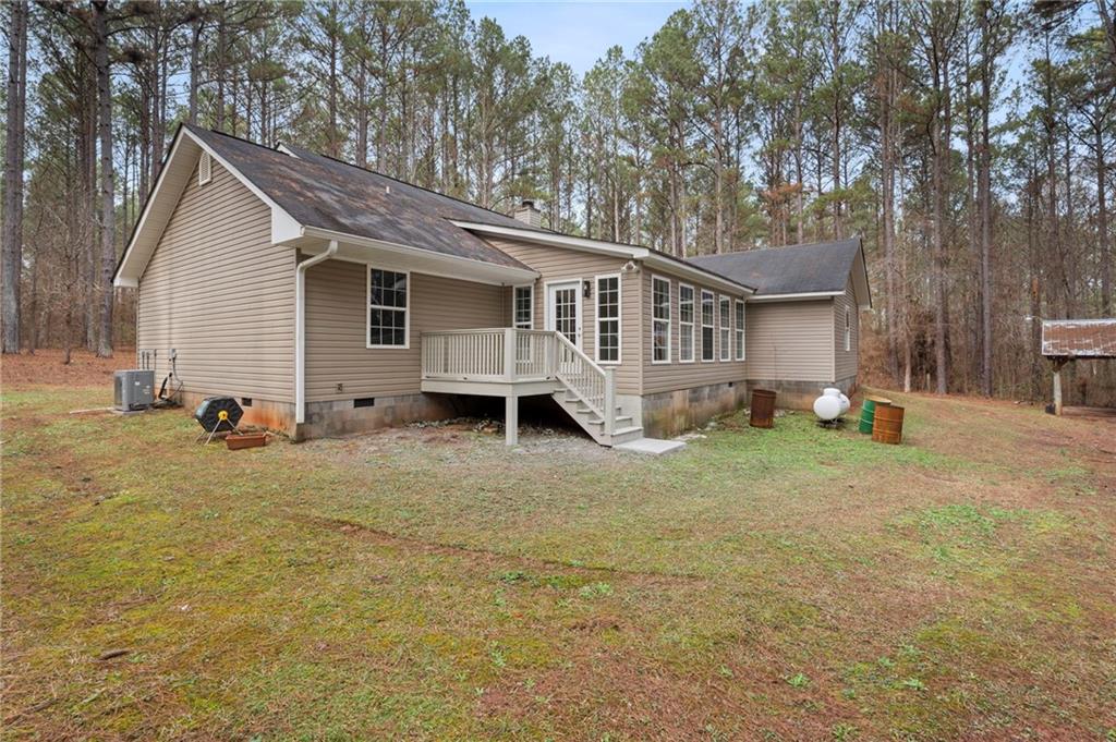 1227 Al Roberts Road Senoia, GA 30276 - Photo 39 of 43 a view of a house with backyard and trees
