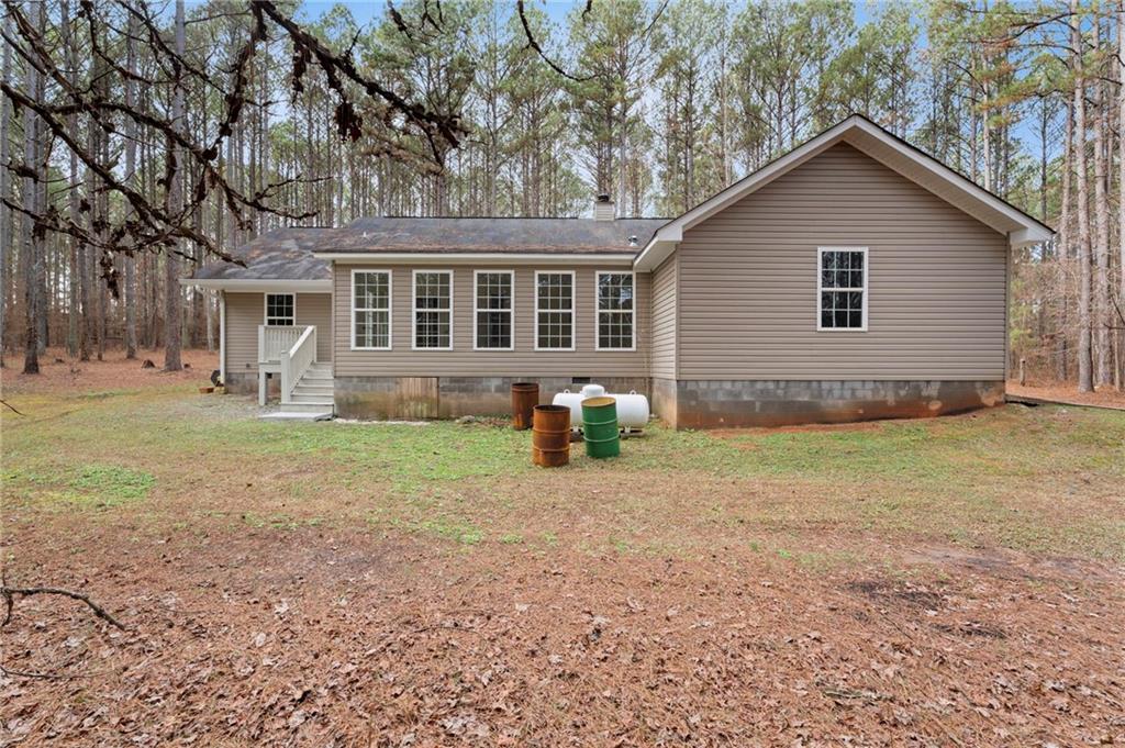 1227 Al Roberts Road Senoia, GA 30276 - Photo 40 of 43 a front view of house with yard and trees around