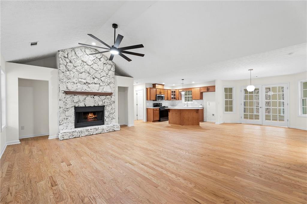 1227 Al Roberts Road Senoia, GA 30276 - Photo 4 of 43 a view of an empty room with a fireplace and a window