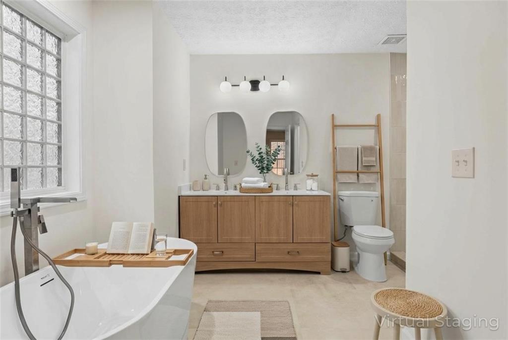 1227 Al Roberts Road Senoia, GA 30276 - Photo 9 of 43 a bathroom with a sink a toilet and mirror