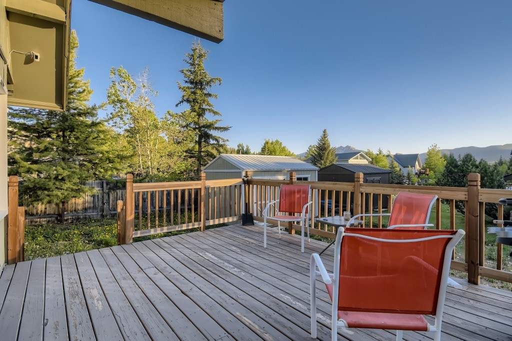 402 Alpine Road Dillon, CO 80435 - Photo 1 of 21 a view of a chairs and table on the wooden deck