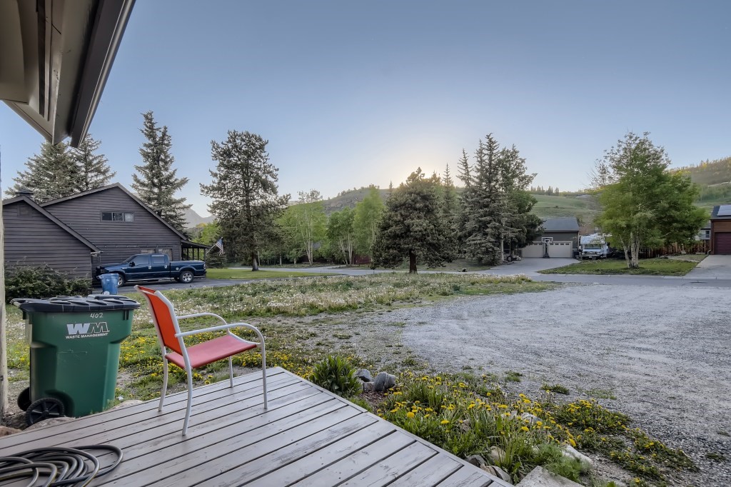 402 Alpine Road Dillon, CO 80435 - Photo 11 of 21 a wooden bench sitting in the middle of a yard