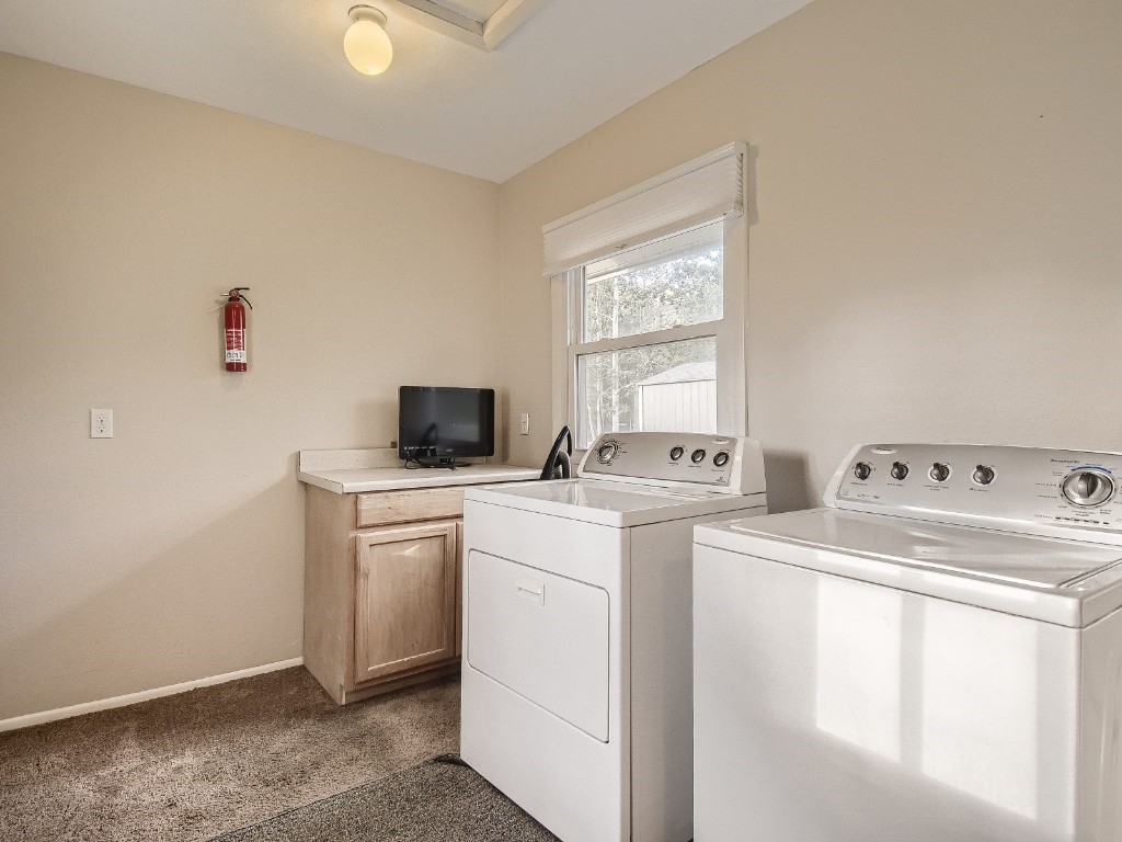 402 Alpine Road Dillon, CO 80435 - Photo 19 of 21 a view of washer and dryer with kitchen countertops