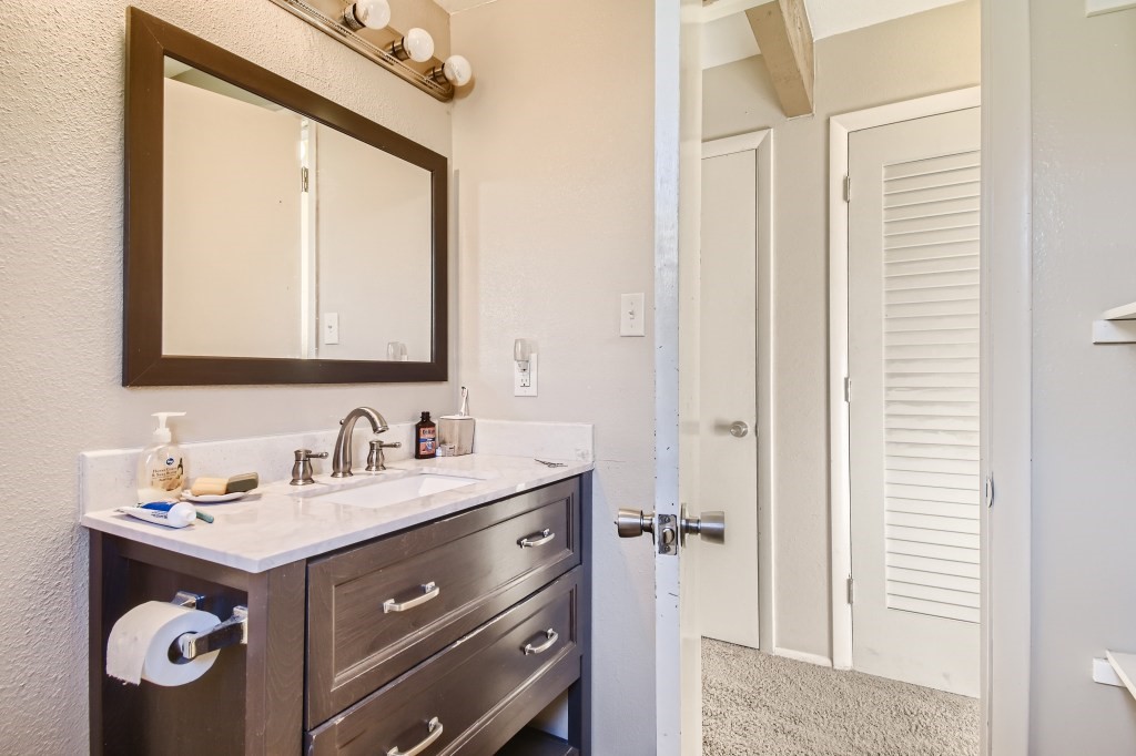 402 Alpine Road Dillon, CO 80435 - Photo 9 of 21 a bathroom with a sink and a mirror