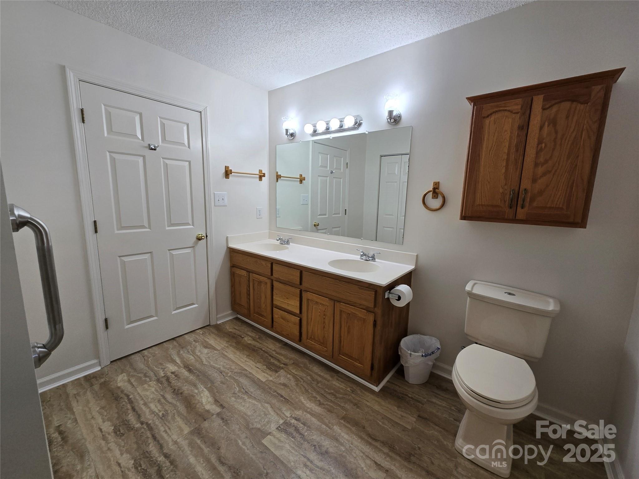 5238 Bethel Church Road Hickory, NC 28602 - Photo 21 of 22 a spacious bathroom with a toilet sink vanity and mirror