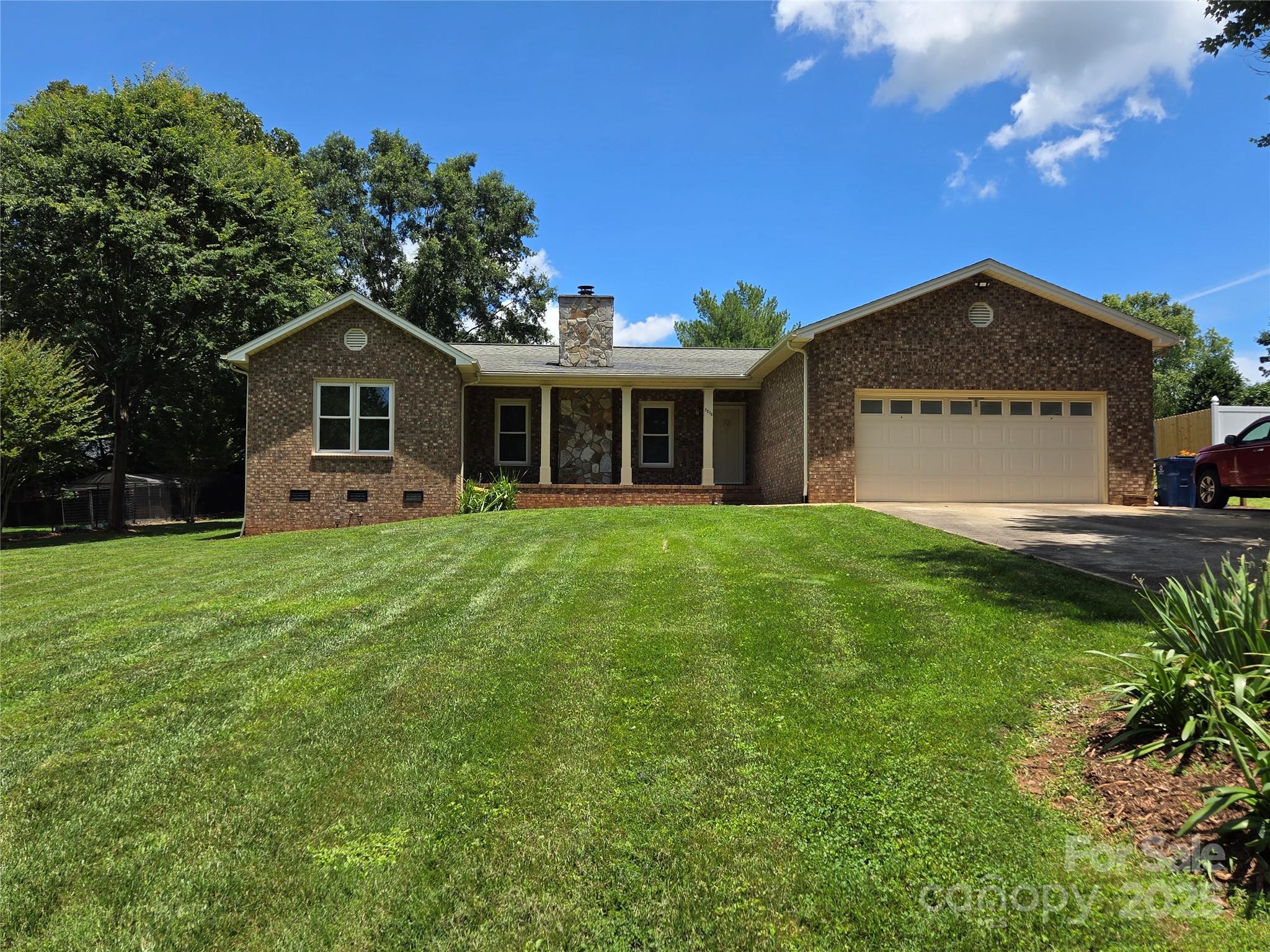 5238 Bethel Church Road Hickory, NC 28602 - Photo 3 of 22 a front view of a house with a garden and yard