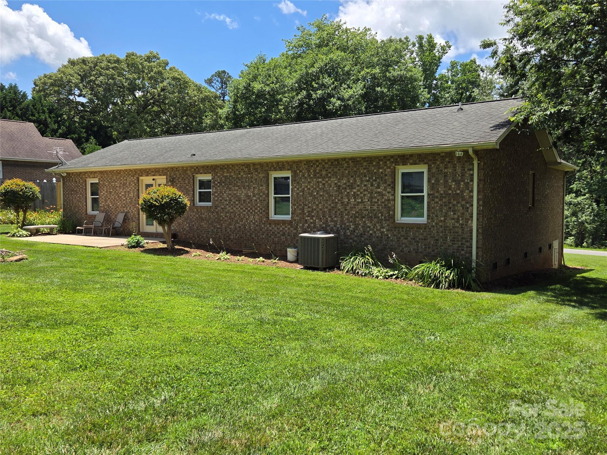 5238 Bethel Church Road Hickory, NC 28602 - Photo 6 of 22 a backyard of a house with potted plants and large tree