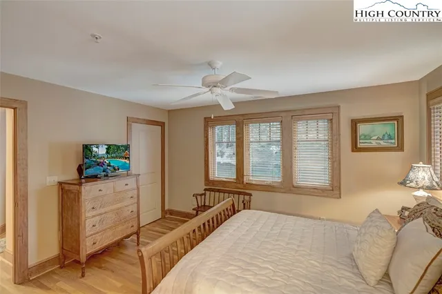 a bed room with a bed and a window