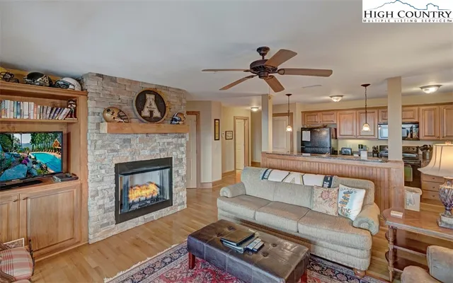 a living room with furniture and a fireplace