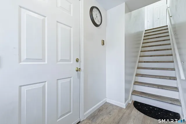 a view of a room with stairs and a window