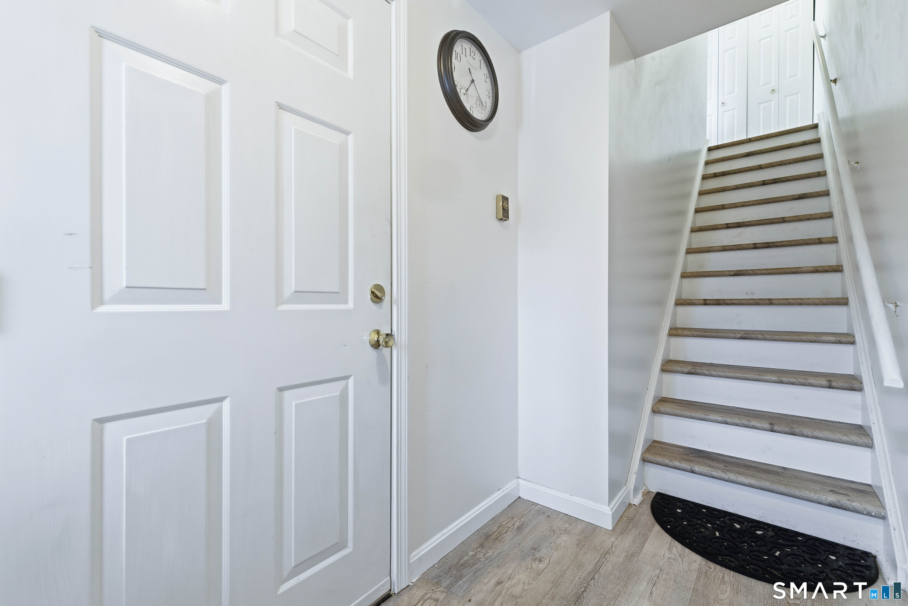 310 Boston Post Road, Unit 76 Waterford, CT 06385 - Photo 3 of 40 a view of a room with stairs and a window