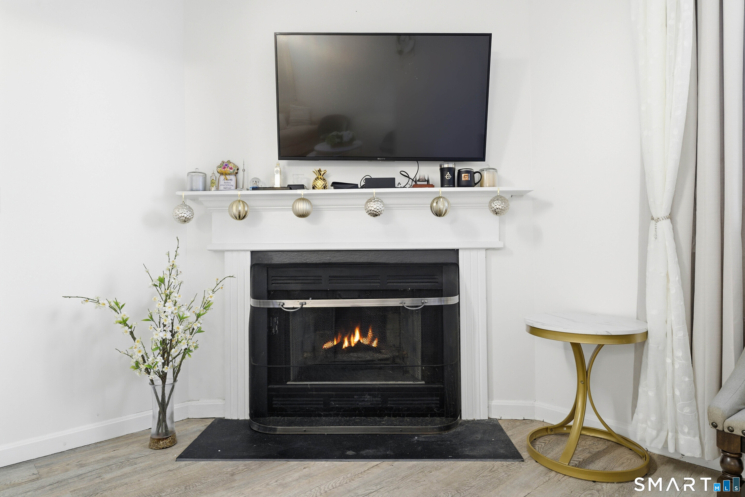 310 Boston Post Road, Unit 76 Waterford, CT 06385 - Photo 8 of 40 a living room with furniture and a fireplace