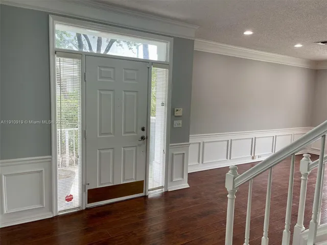 a view of entryway with wooden floor