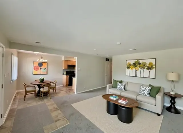 a living room with furniture and window