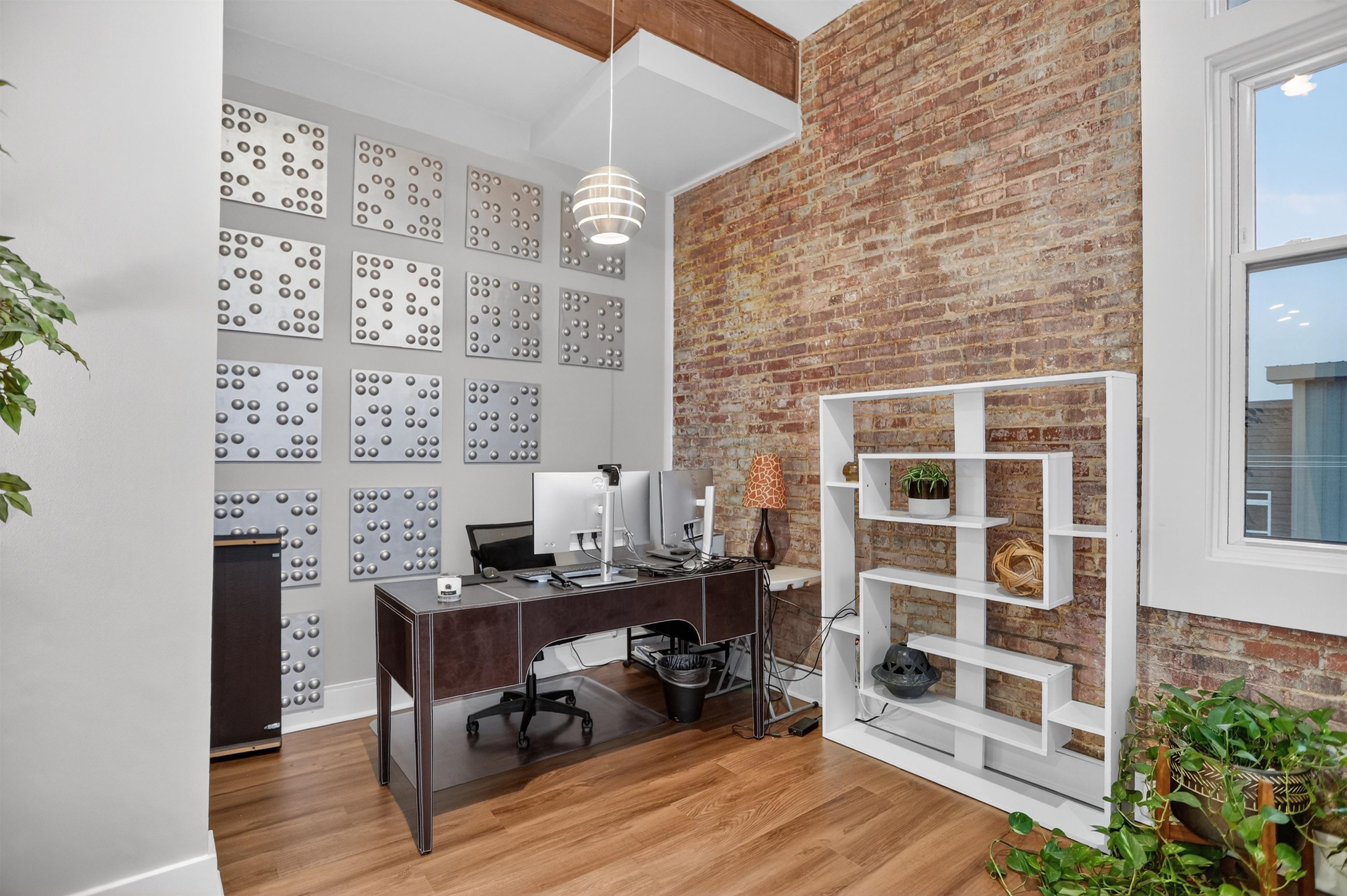 435 South Front Street, Unit 307 Memphis, TN 38103 - Photo 15 of 40 a view of a workspace with furniture and wooden floor