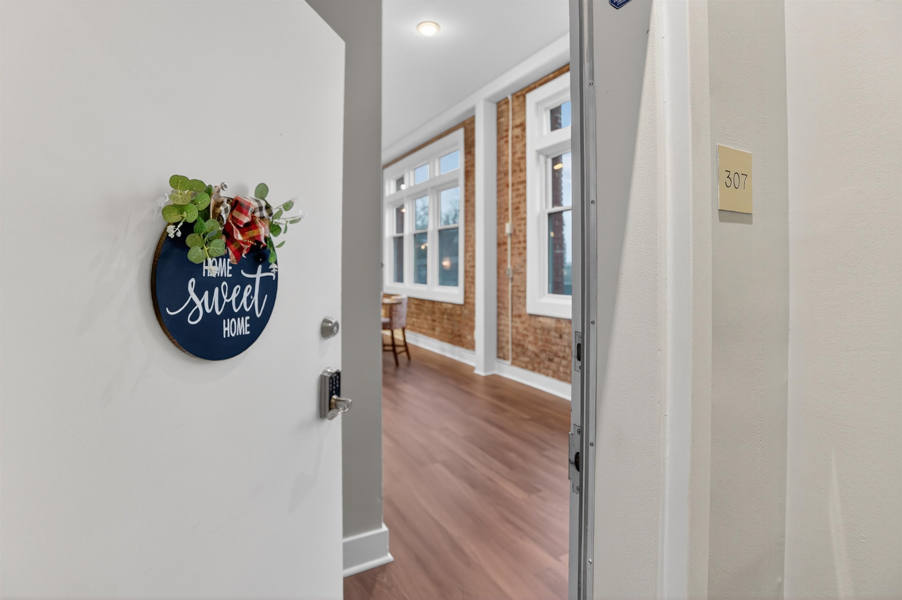 435 South Front Street, Unit 307 Memphis, TN 38103 - Photo 2 of 40 a view of an entryway with wooden floor