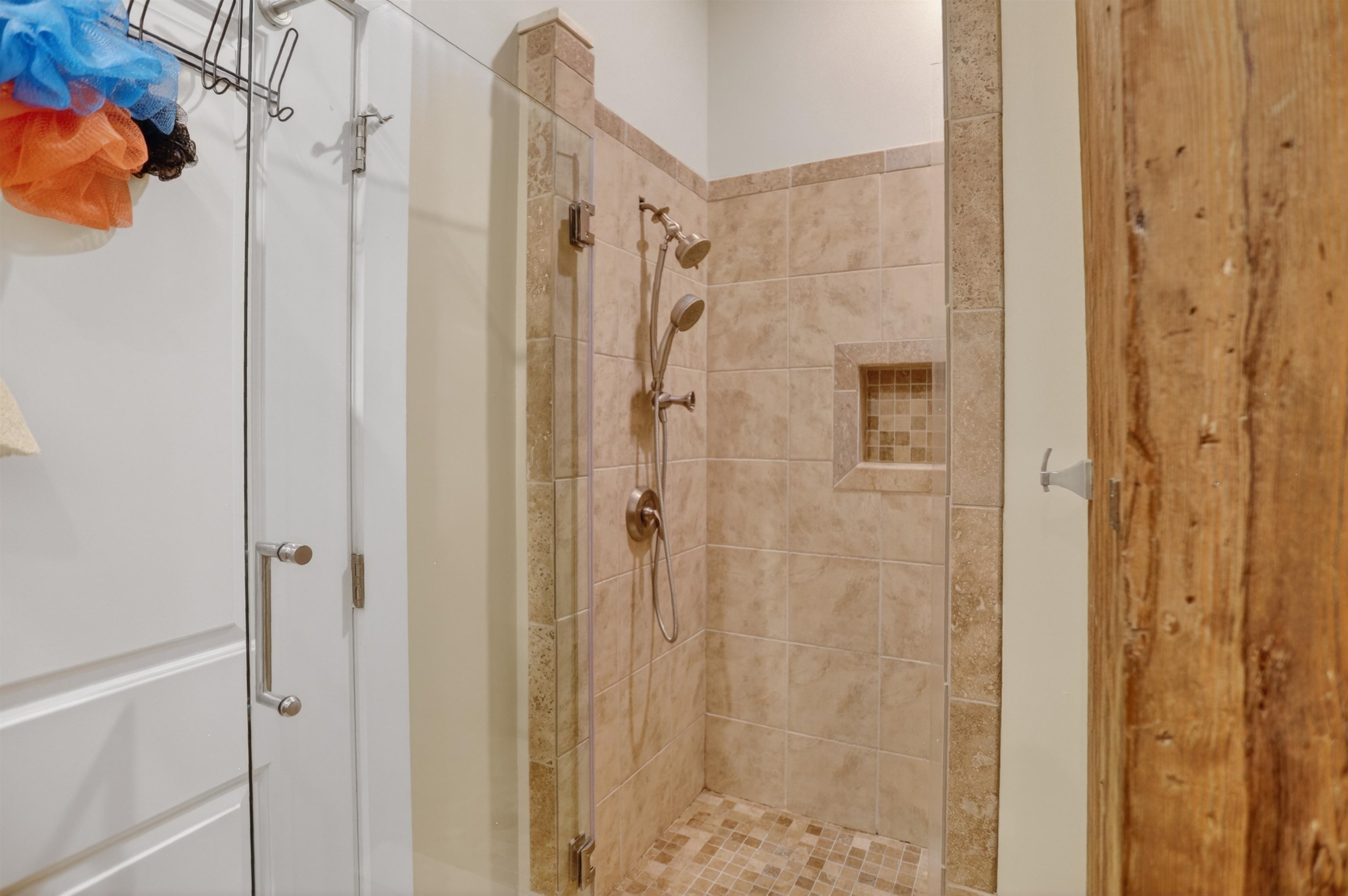 435 South Front Street, Unit 307 Memphis, TN 38103 - Photo 25 of 40 a bathroom with a shower and a glass door