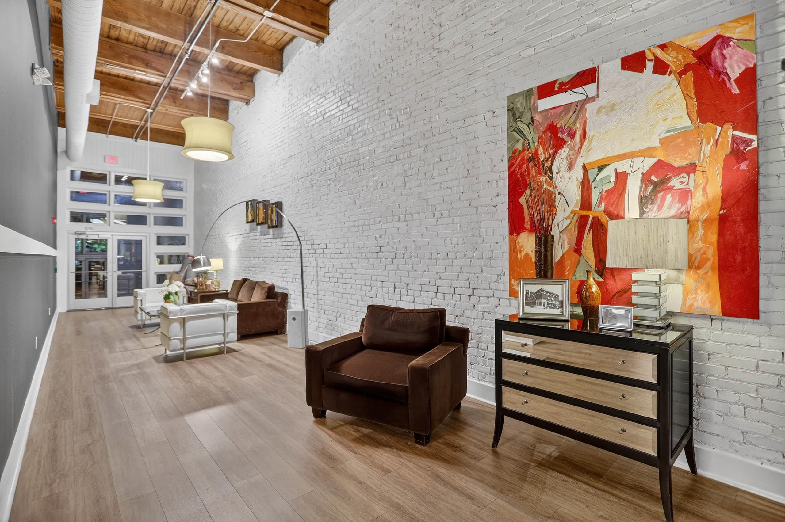 435 South Front Street, Unit 307 Memphis, TN 38103 - Photo 35 of 40 a living room with furniture and wooden floor