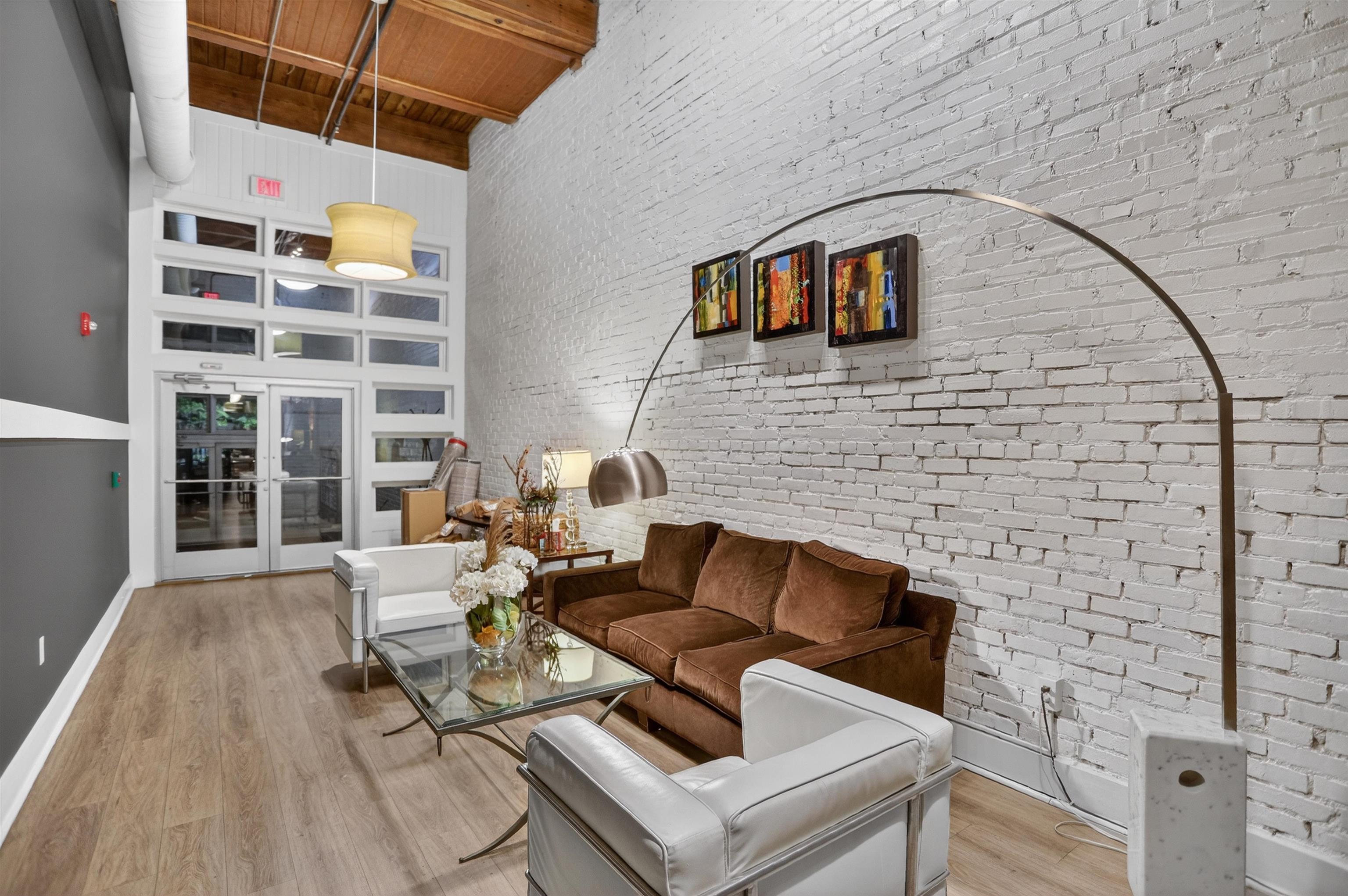 435 South Front Street, Unit 307 Memphis, TN 38103 - Photo 36 of 40 a living room with furniture and a floor to ceiling window