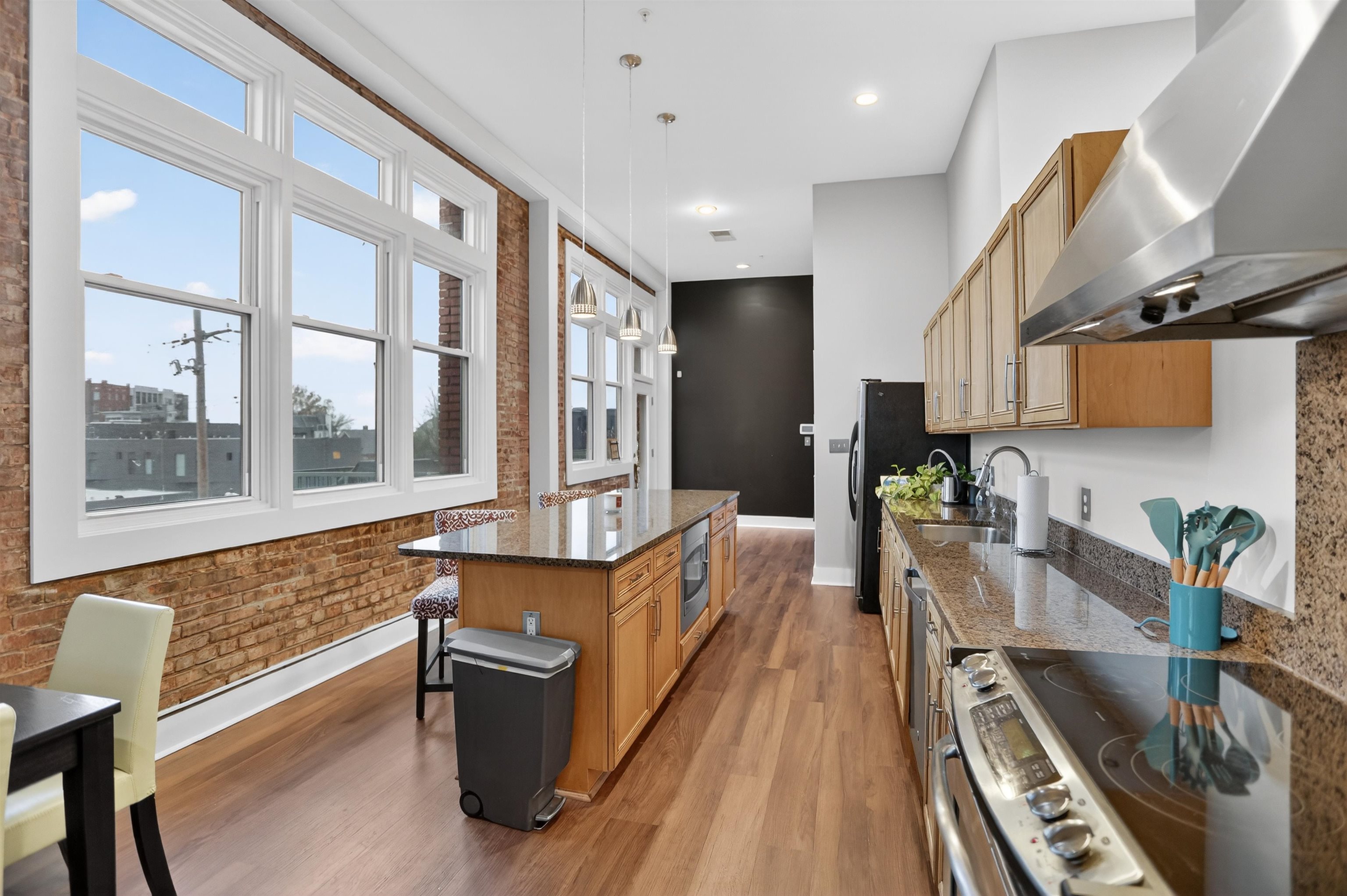 435 South Front Street, Unit 307 Memphis, TN 38103 - Photo 5 of 40 a kitchen with stainless steel appliances granite countertop a stove and a sink
