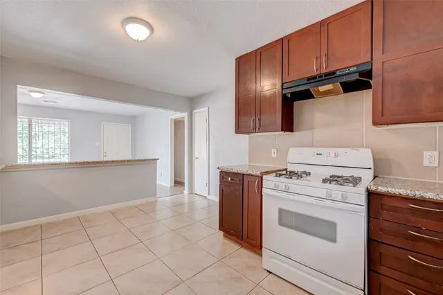 a view of a kitchen with washer and dryer