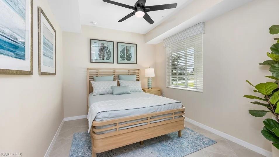 5491 Double Eagle Circle, Unit 3723 Ave Maria, FL 34142 - Photo 10 of 42 Bedroom with ceiling fan and light tile patterned flooring