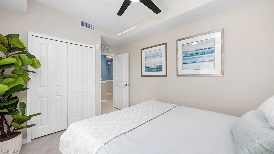 5491 Double Eagle Circle, Unit 3723 Ave Maria, FL 34142 - Photo 11 of 42 Bedroom with light tile patterned floors, a closet, and ceiling fan