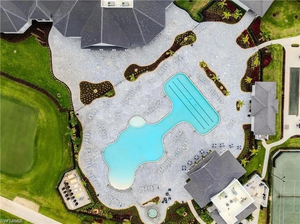 5491 Double Eagle Circle, Unit 3723 Ave Maria, FL 34142 - Photo 19 of 42 Drone / aerial view of a pool area