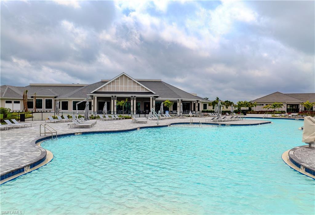 5491 Double Eagle Circle, Unit 3723 Ave Maria, FL 34142 - Photo 20 of 42 Community pool with a patio area