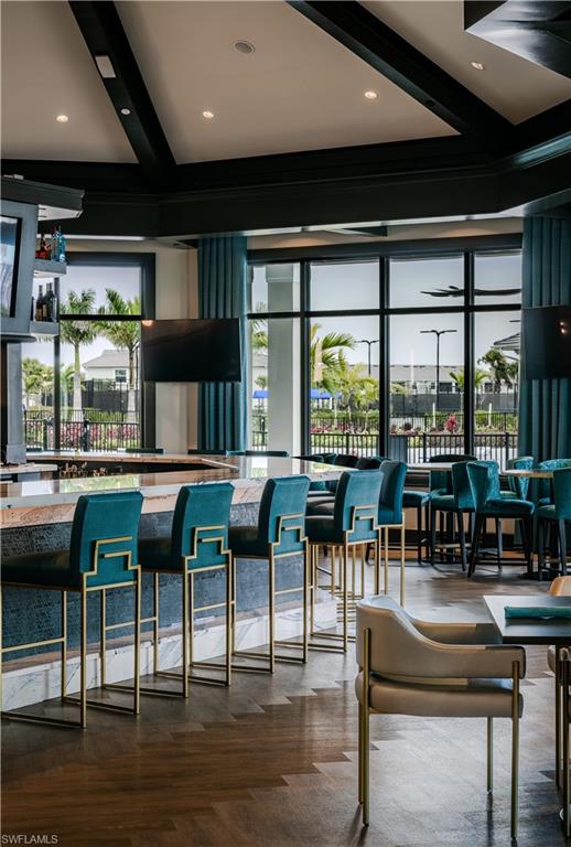 5491 Double Eagle Circle, Unit 3723 Ave Maria, FL 34142 - Photo 28 of 42 Bar with beamed ceiling, plenty of natural light, and recessed lighting