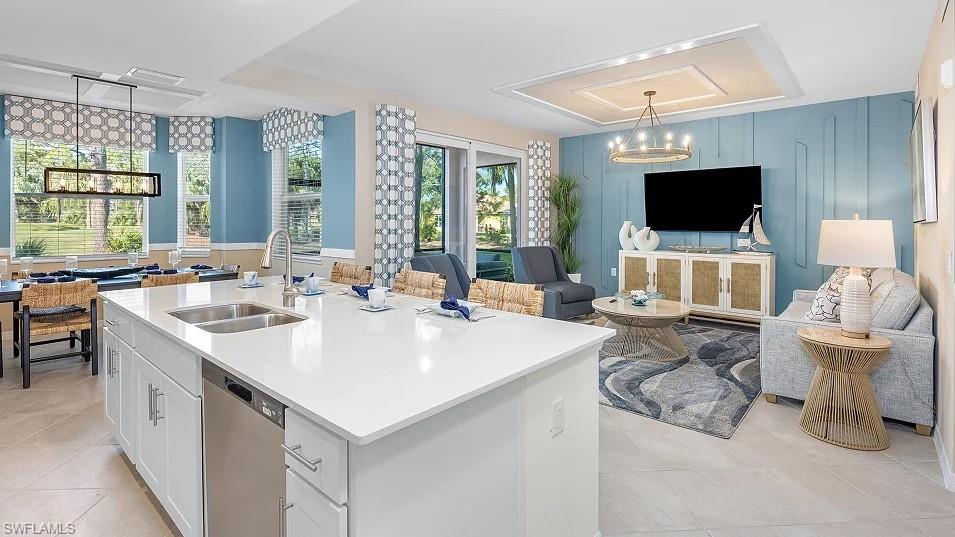 5491 Double Eagle Circle, Unit 3723 Ave Maria, FL 34142 - Photo 42 of 42 Kitchen with white cabinetry, hanging light fixtures, dishwasher, light tile patterned floors, and open floor plan