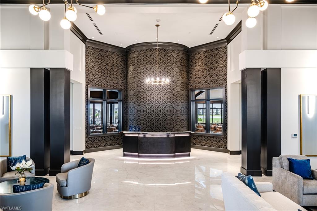 5491 Double Eagle Circle, Unit 3723 Ave Maria, FL 34142 - Photo 35 of 42 Reception with a chandelier and a high ceiling