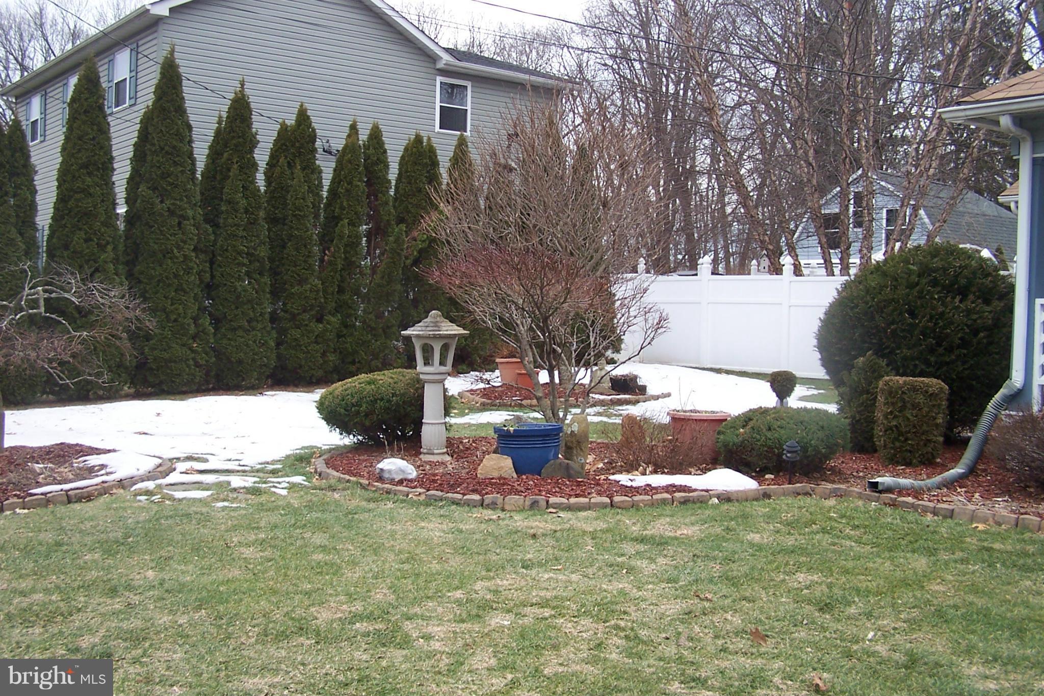 2728 Paper Mill Road Phoenix, MD 21131 - Photo 5 of 19 a front view of a house with garden