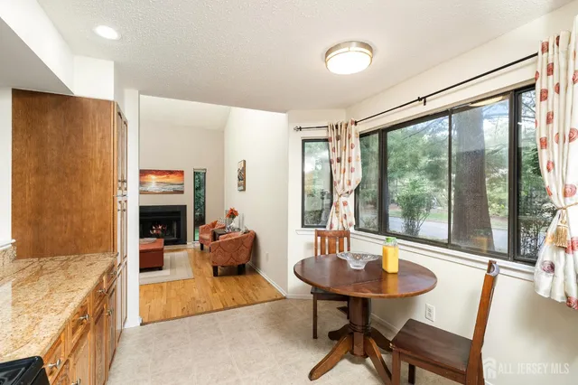 a view of a dining room with furniture window and outside view