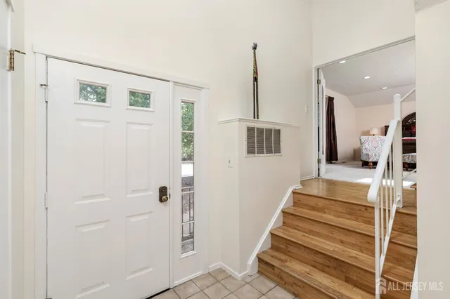 a bedroom with furniture and window