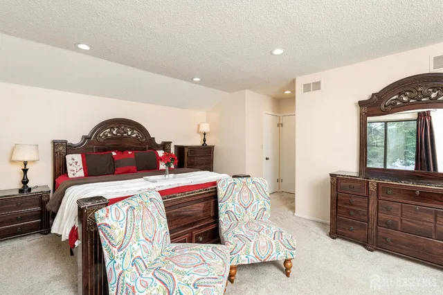 a living room with furniture and large windows