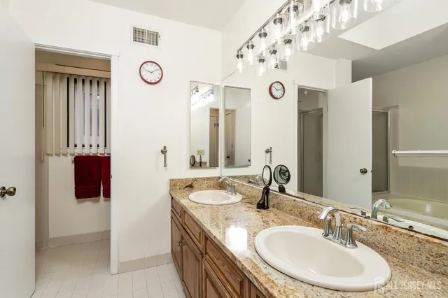 a bathroom with a tub and shower
