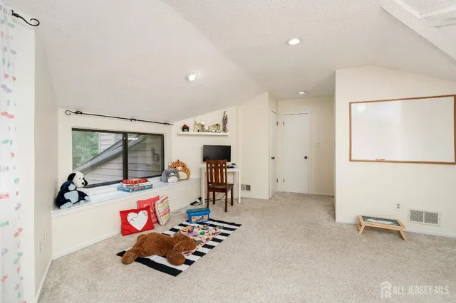 a bathroom with a granite countertop sink toilet a large mirror and shower