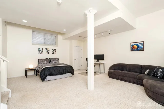 a bedroom with a bed and a cabinets
